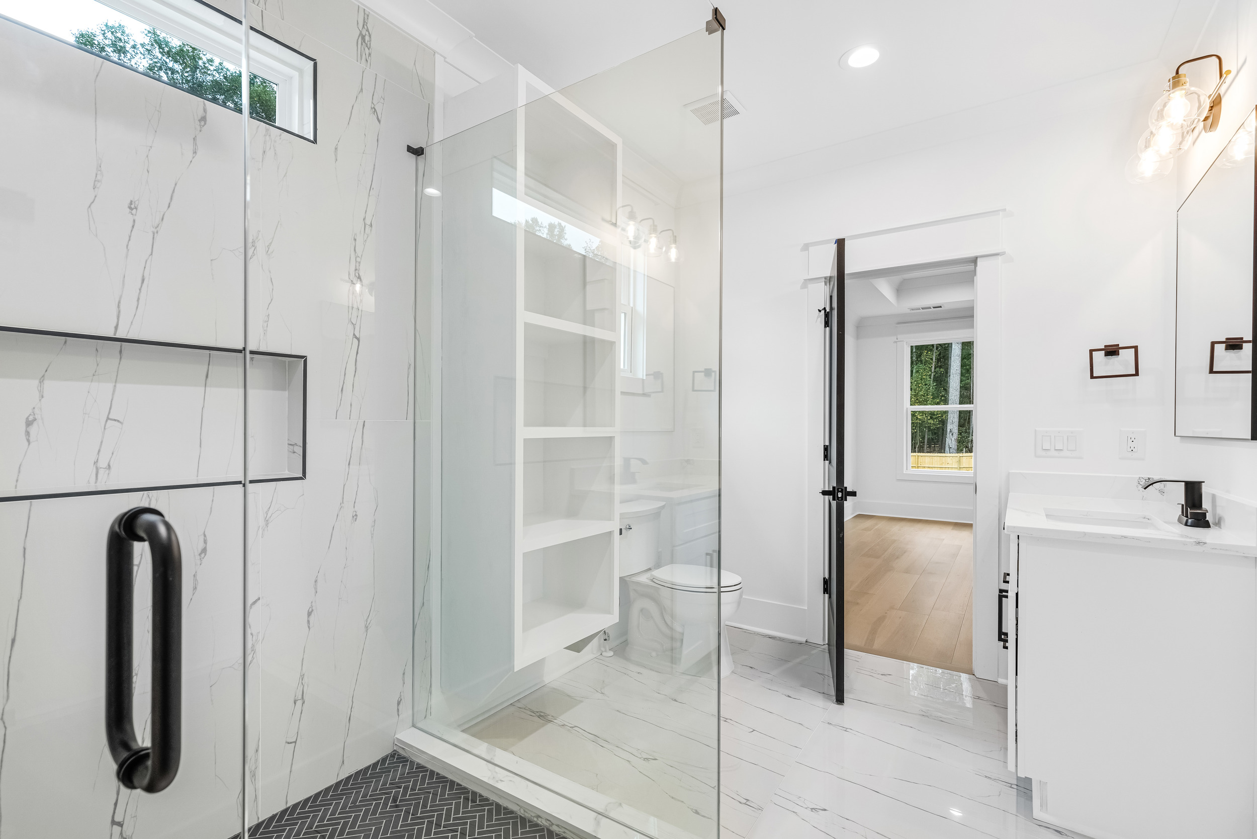 Walk-in shower with glass enclosure